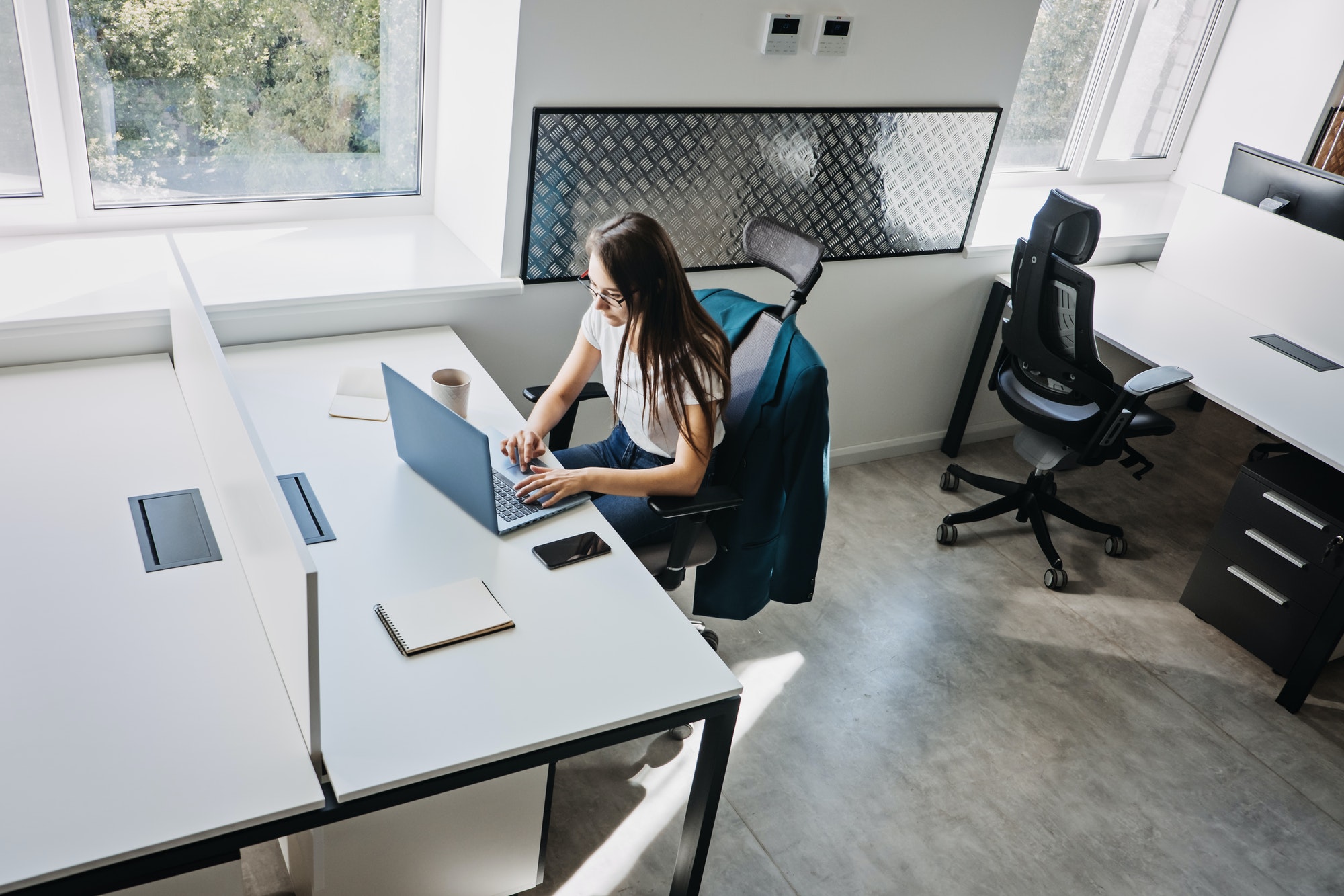 Young female programmer web developer working on computer software